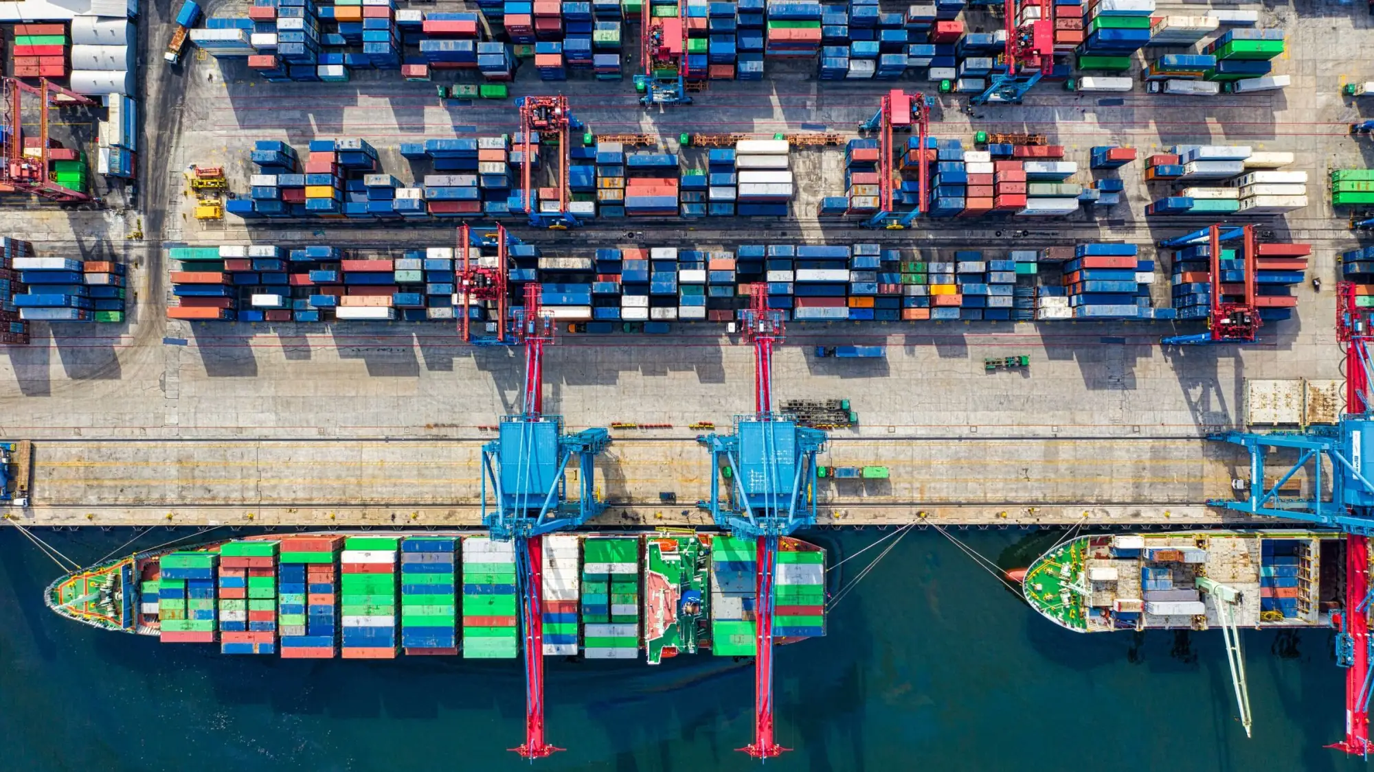 Container cargo logistics terminal with ships and cranes for global freight coordination
